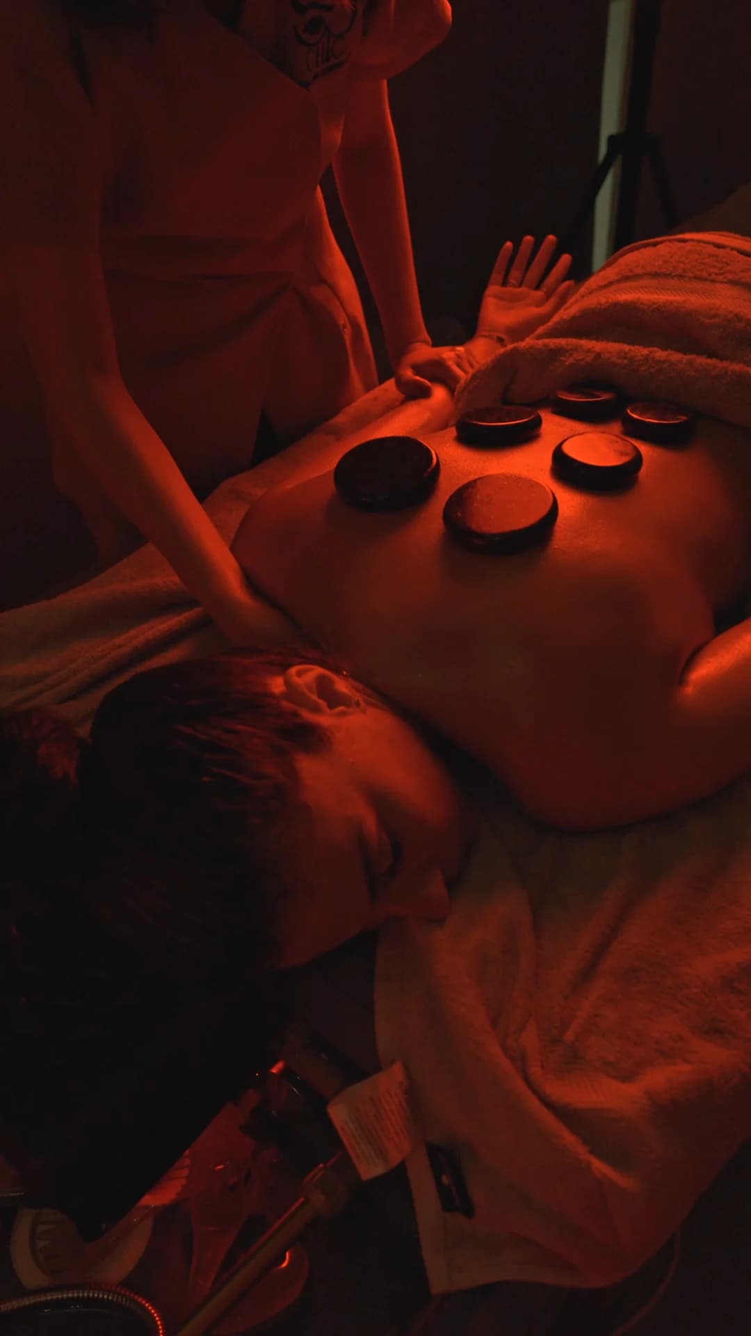 Hot stone massage in red light