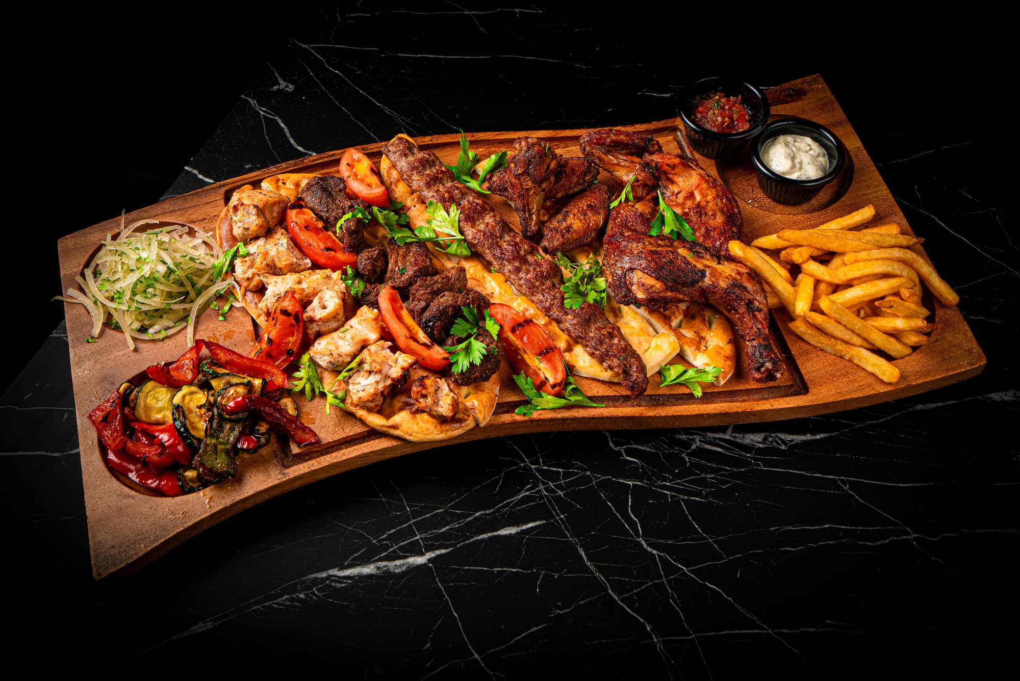 Mixed grill on a wooden board at Vesna